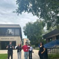 Students posing for a picture outside Mackinac Hall at GVSU during orientation (3)